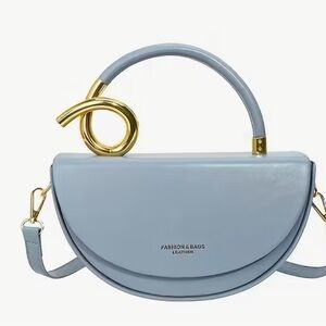 Stylish Blue Handbag with Gold Accent